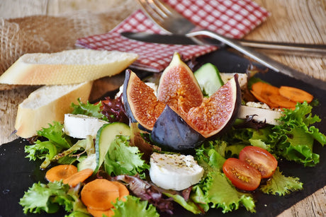 Heart-healthy foods like nuts, soy protein, and vegetables in a balanced meal.